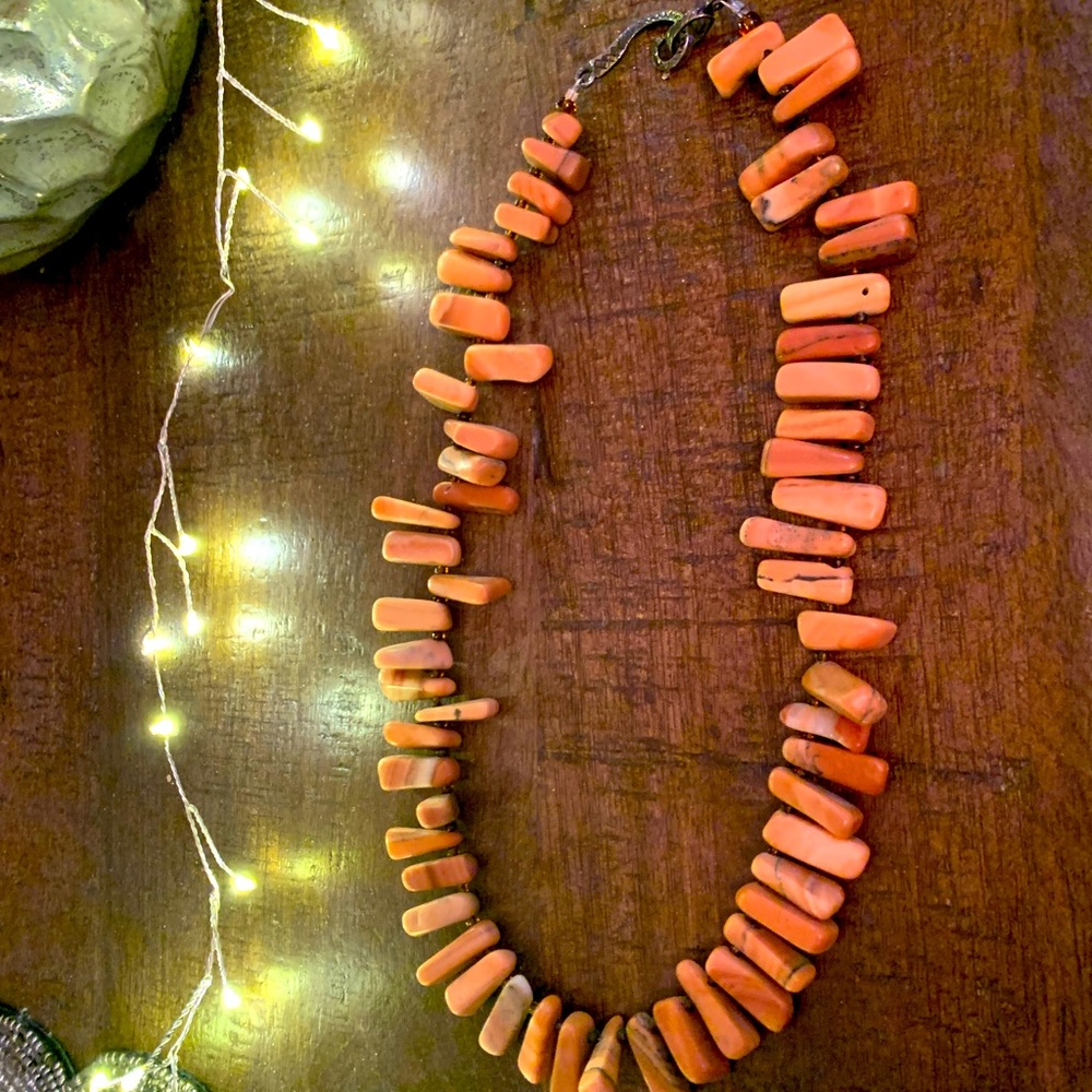 Natural Red Jasper handcrafted necklace with antique silver scroll closure.